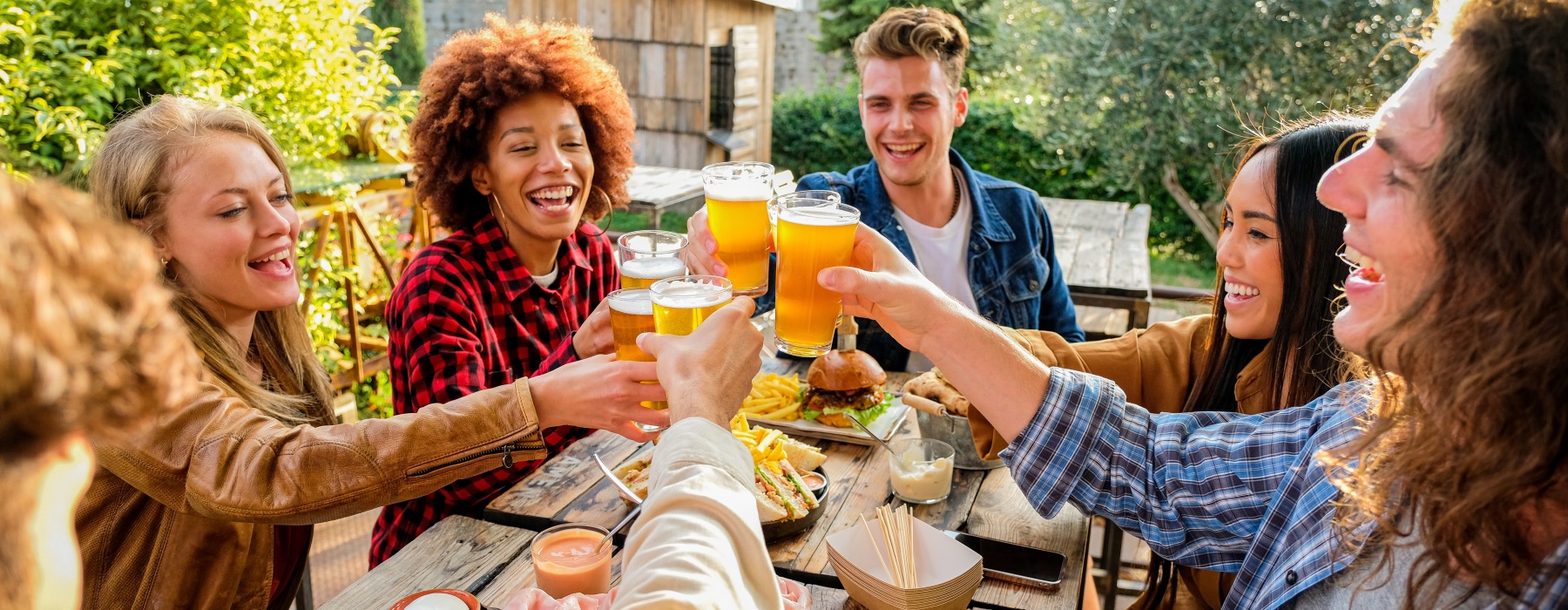 group of people clinking glasses