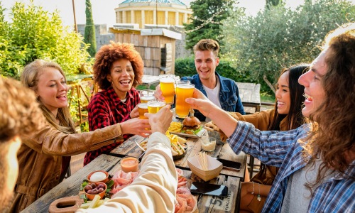 group of people clinking glasses