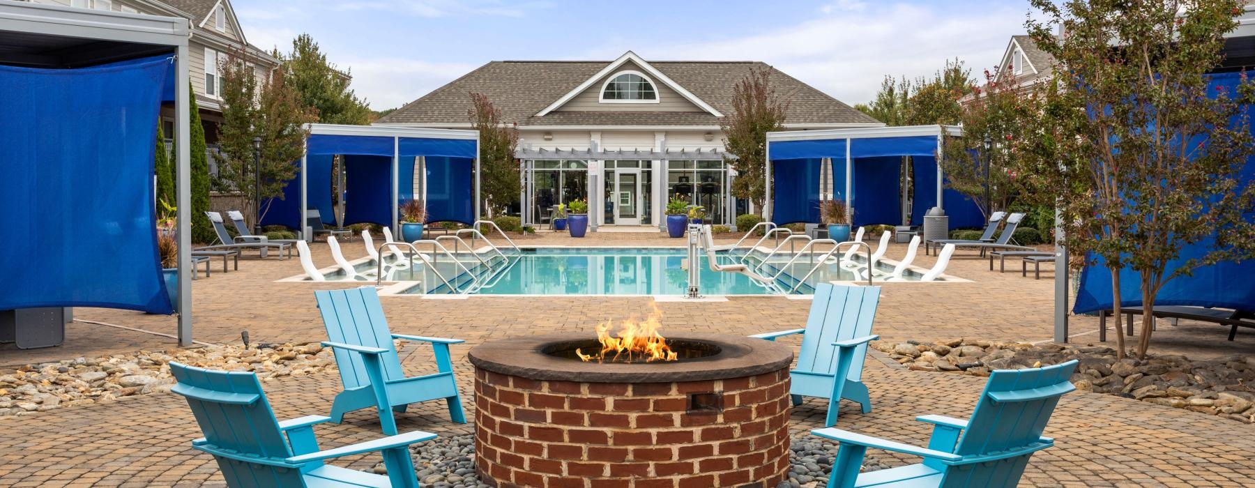 a patio with chairs and a table