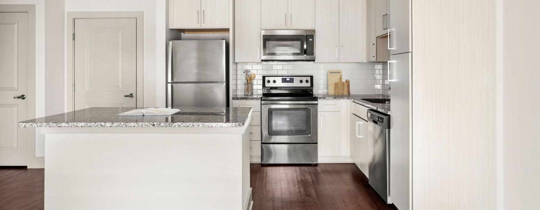 a kitchen with white cabinets