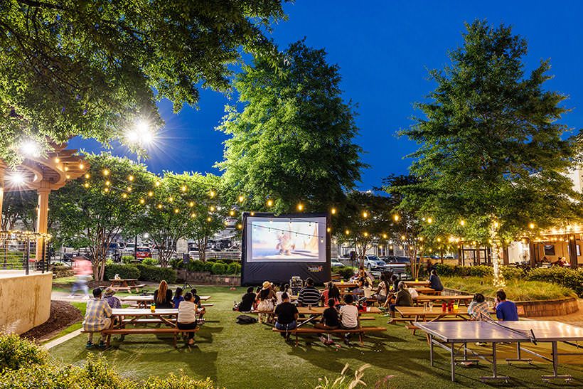 people watching a movie in a park